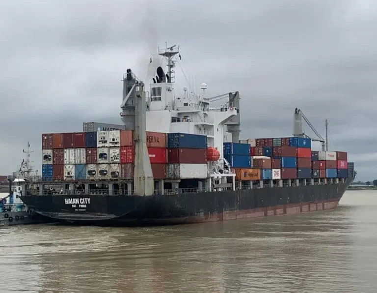 Cargo ship 'Haian City' with hull damage post-collision.
